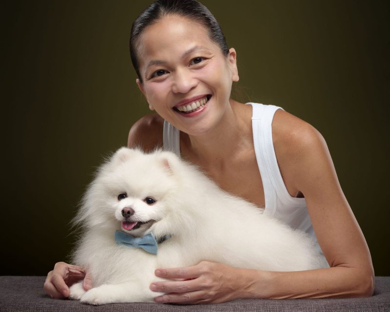 Angus the Pomeranian photographed with his owner during a PawPlay Studios session